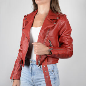  Woman in red leather jacket with zippers, silver buttons, white top, and light blue jeans