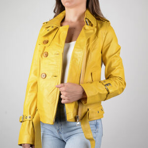  Woman in bright yellow leather jacket with buttons, light blue jeans, and white top